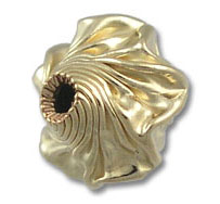 ornate gold fluted bead with central hole