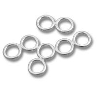 Silver jump rings on white background